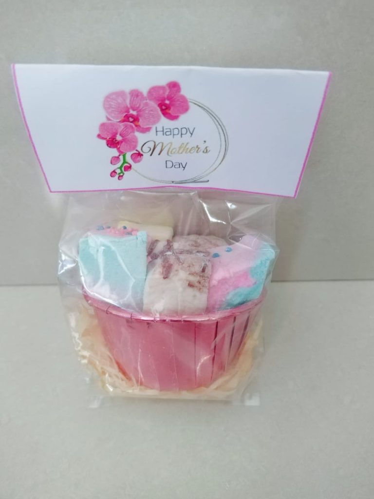A wrapped Sweet Mallows gift pack with a printed topper